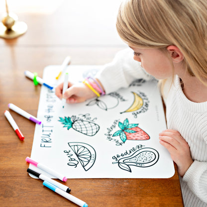 Girl coloring on silicone mat