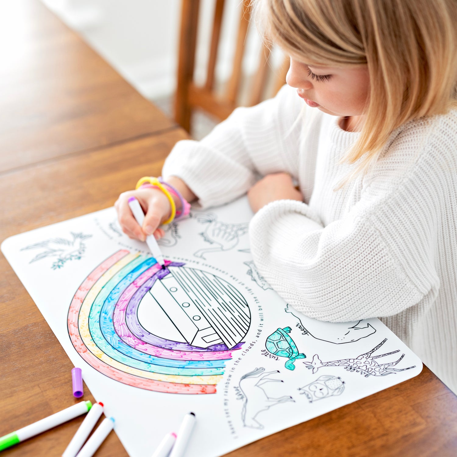 Girl coloring on silicone mat