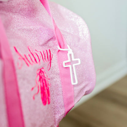 Cross Charm on duffle bag