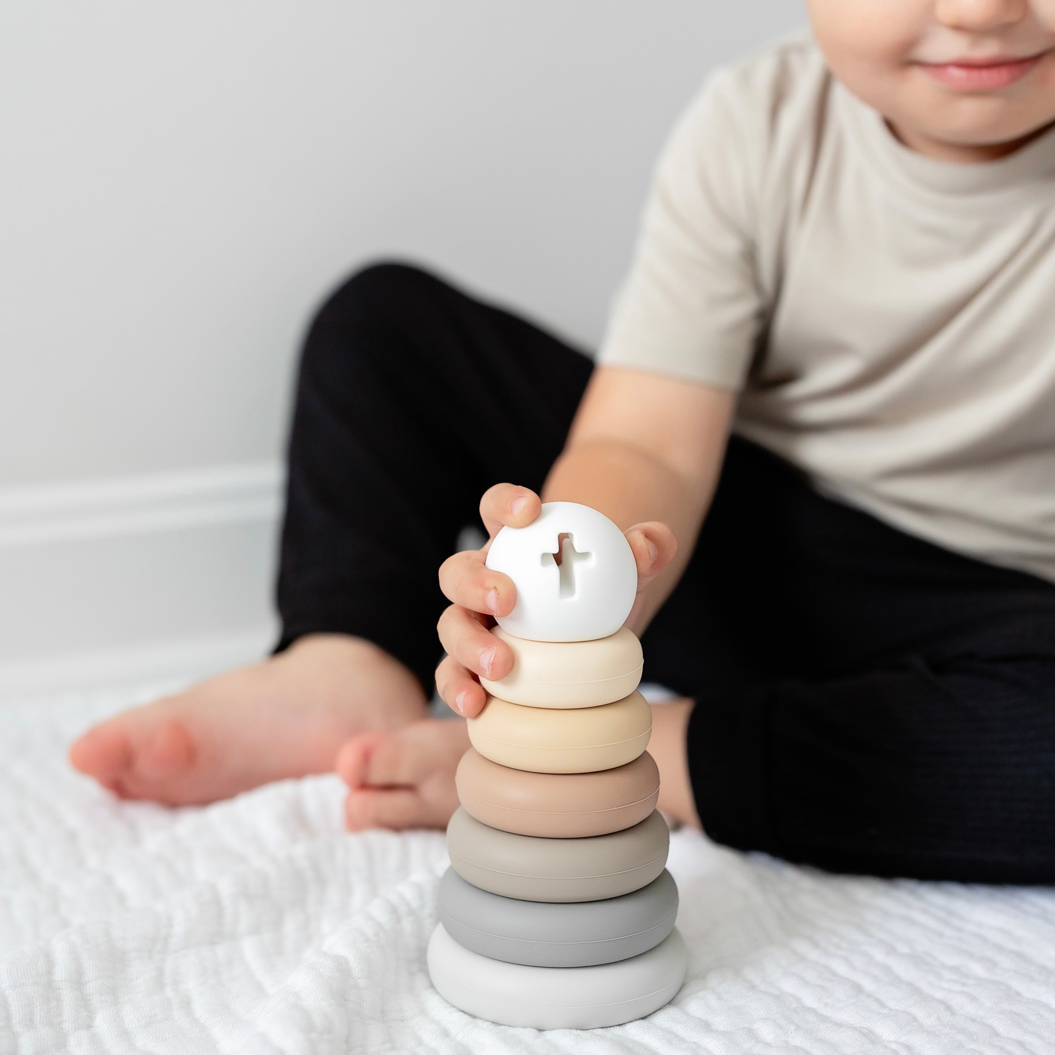 Baby playing with Cross Stacker