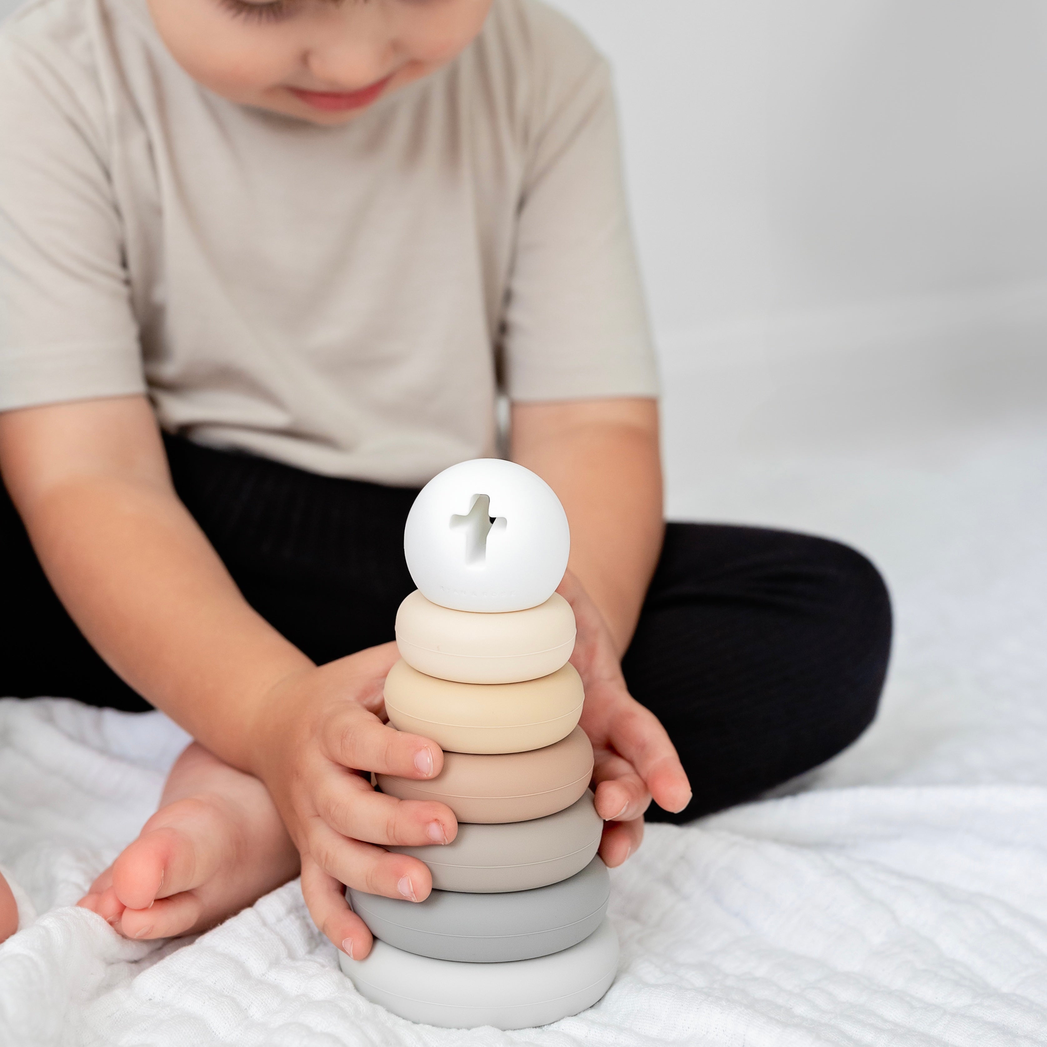 Baby playing with Cross Stacker