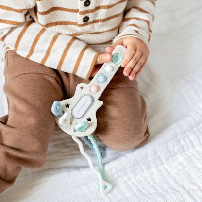 Baby with guitar toy