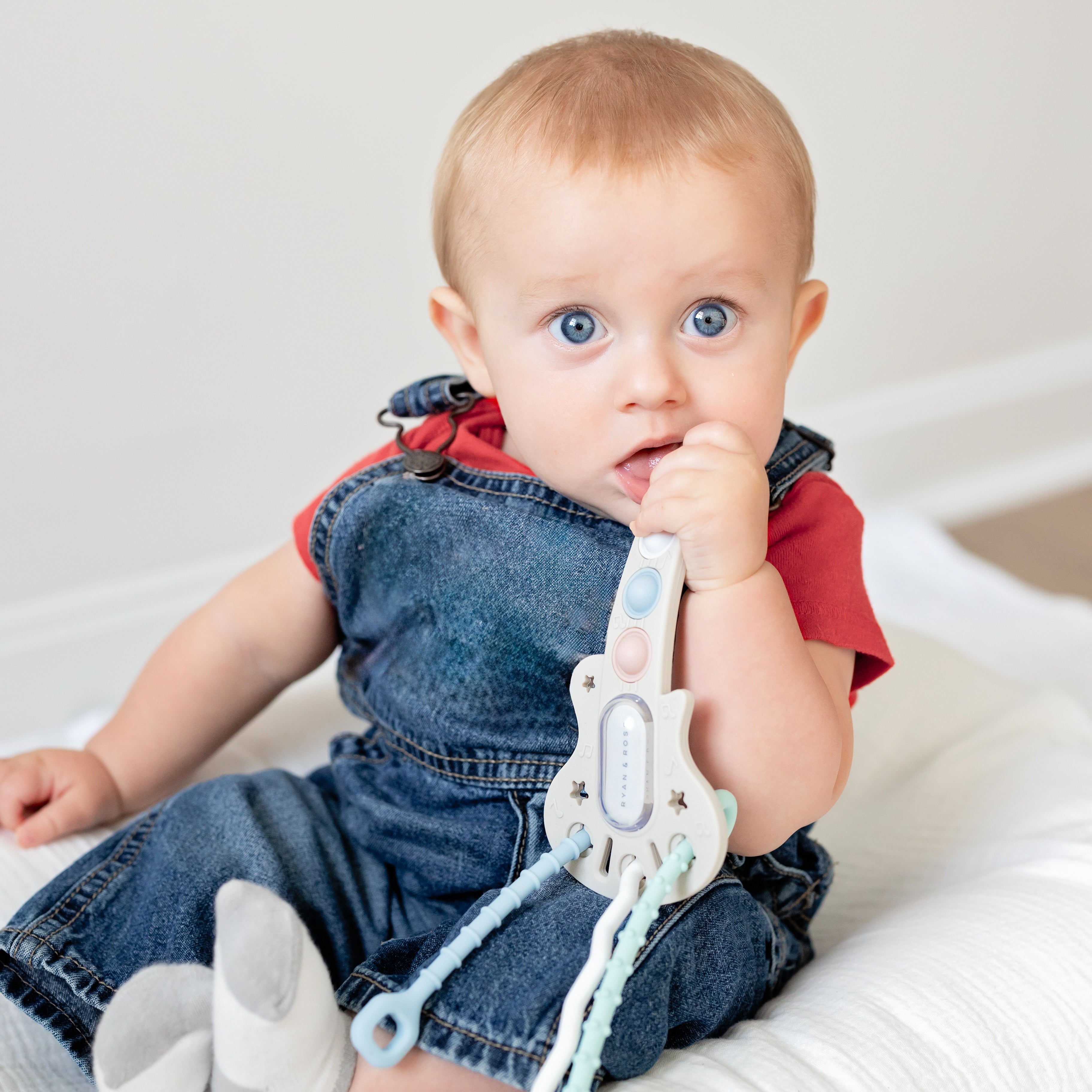 Baby with guitar toy