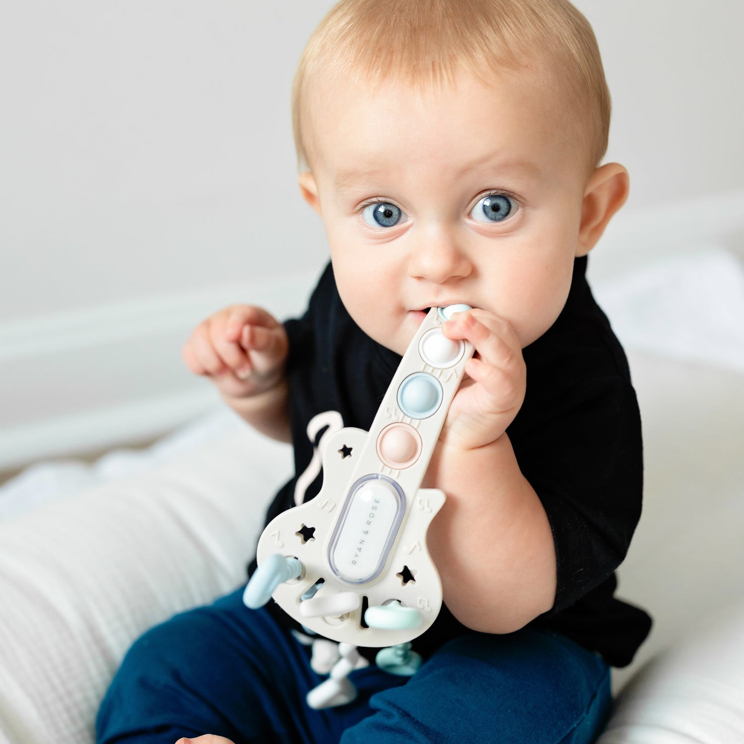 Baby with guitar toy