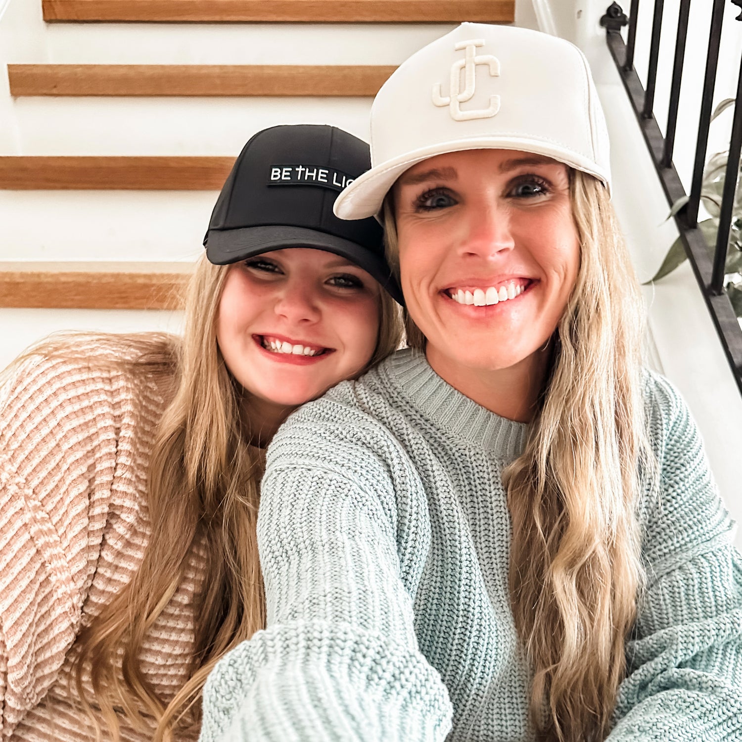 Mom and daughter wearing hats