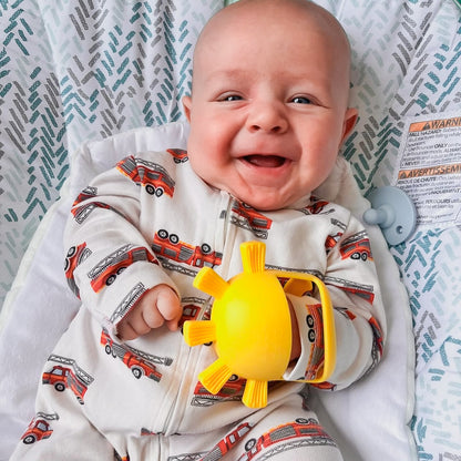 Baby with teething mitt