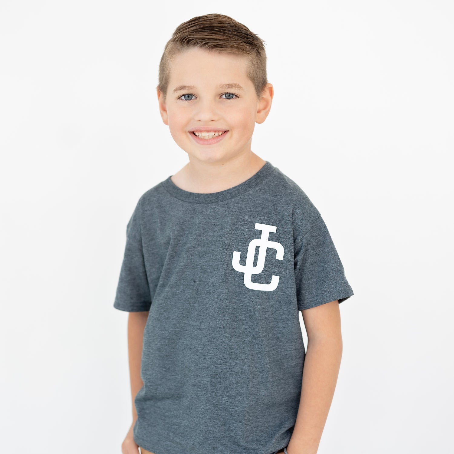 Kid modeling JC shirt