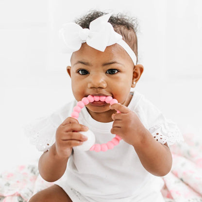 Baby playing with Cutie Teether Rattle